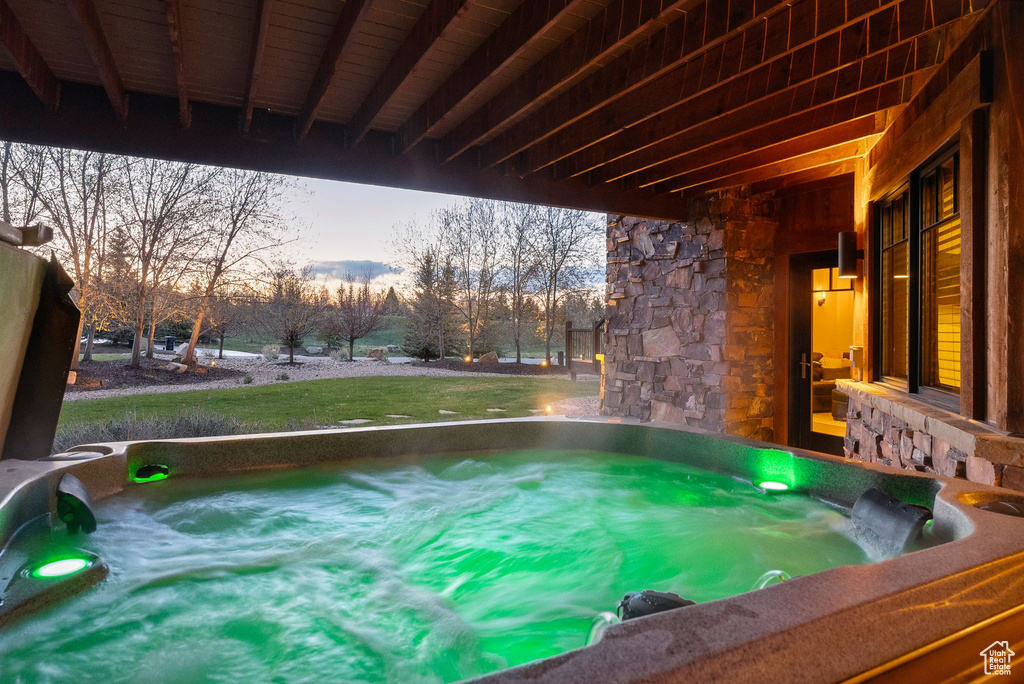 Exterior space with a hot tub