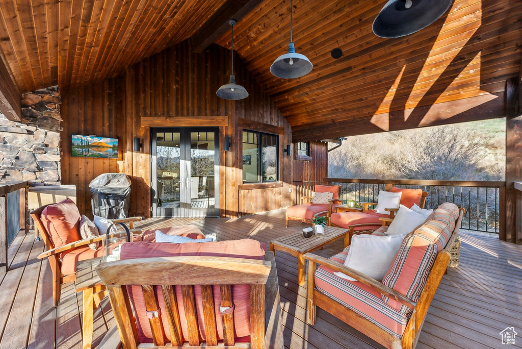 Wooden deck featuring french doors, an outdoor hangout area, and area for grilling