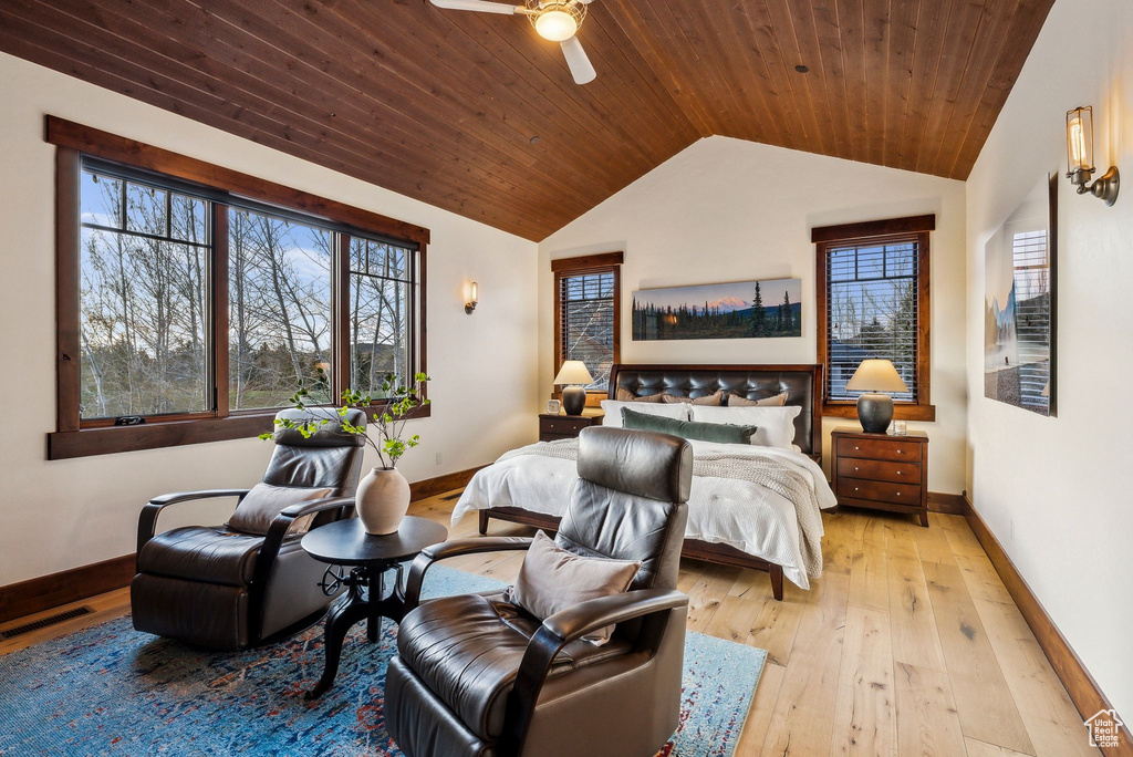 Bedroom with wooden ceiling, baseboards, light wood-style floors, and vaulted ceiling