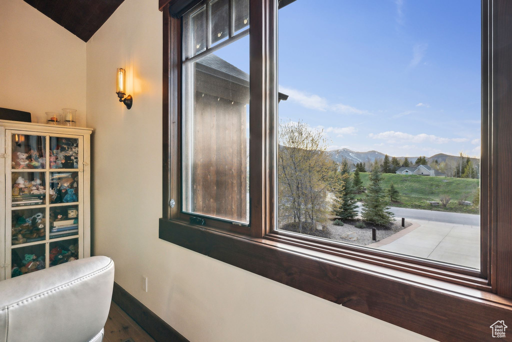 Interior space with baseboards and a mountain view