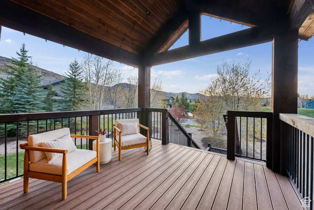 Wooden terrace featuring a mountain view
