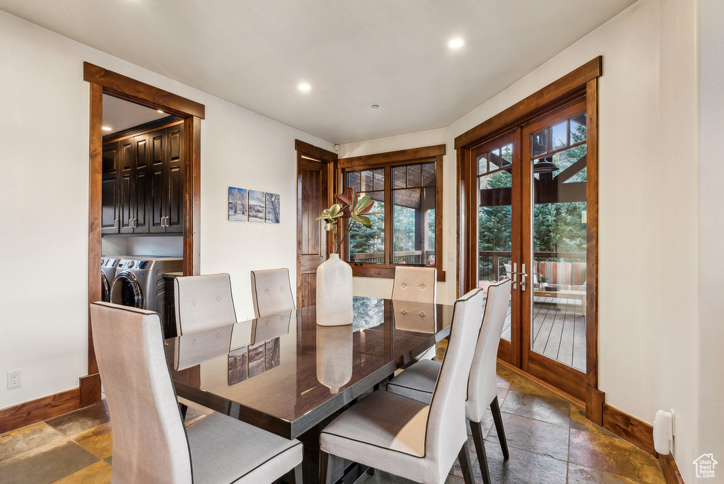 Dining room with french doors, baseboards, stone tile flooring, recessed lighting, and washer and dryer