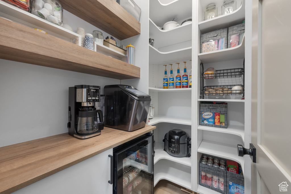 Pantry featuring wine cooler