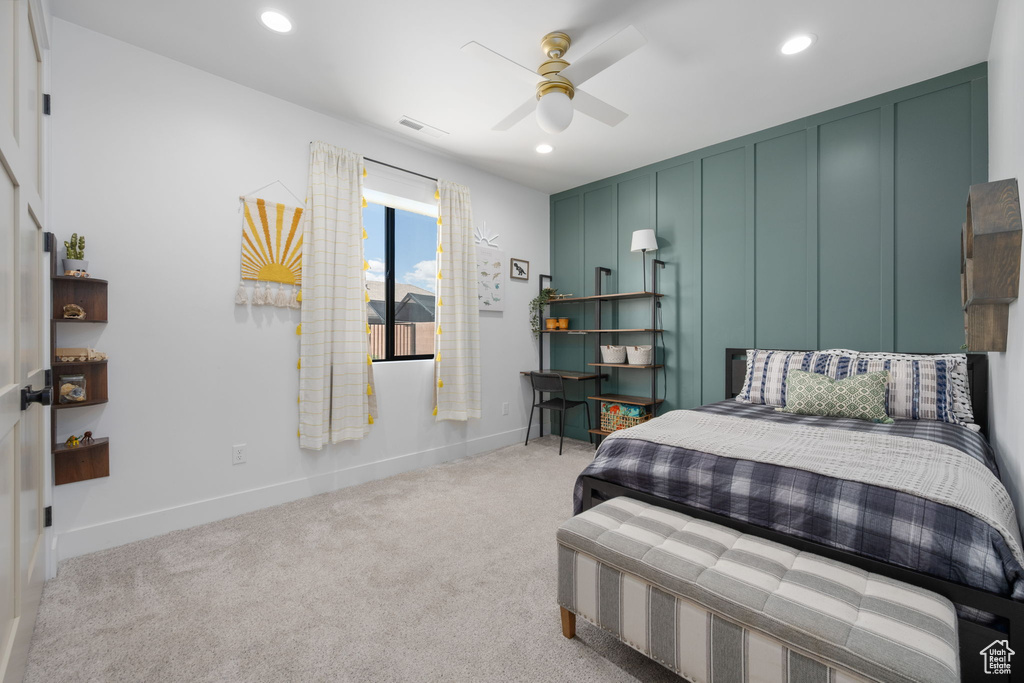 Bedroom featuring light colored carpet, recessed lighting, baseboards, a ceiling fan, and visible vents