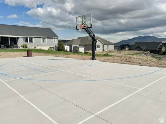View of sport court featuring a mountain view and basketball court