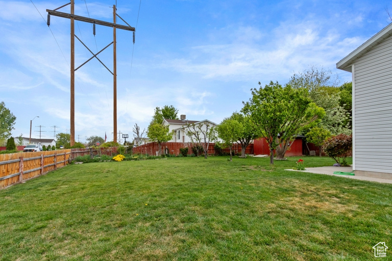View of yard with a fenced backyard