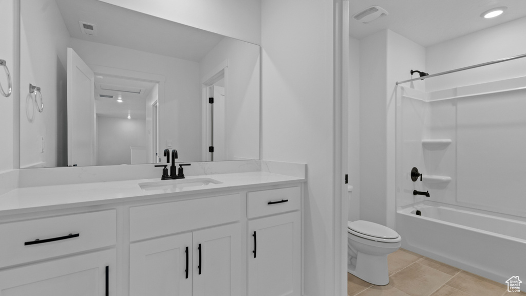 Full bath with vanity, visible vents, toilet, and tub / shower combination