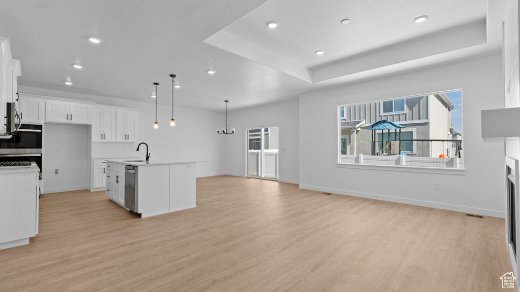 Kitchen featuring recessed lighting, appliances with stainless steel finishes, and light wood finished floors