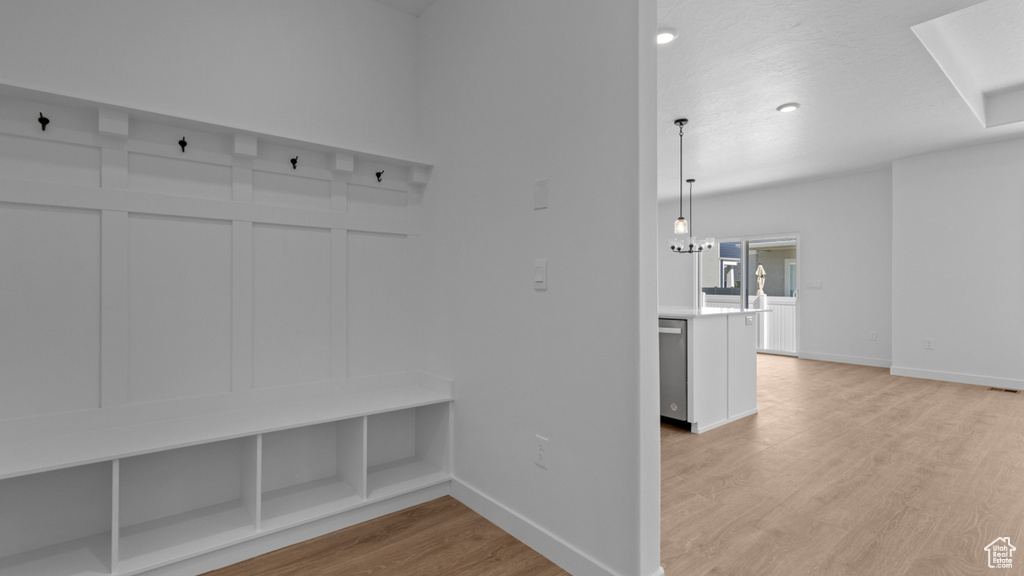Mudroom with baseboards and light wood finished floors