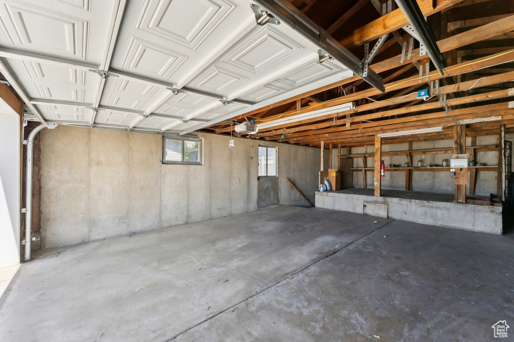 Garage featuring a garage door opener
