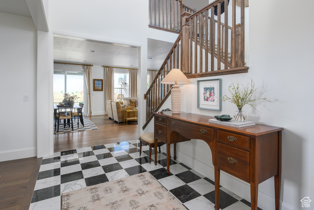 Entryway with baseboards and stairs