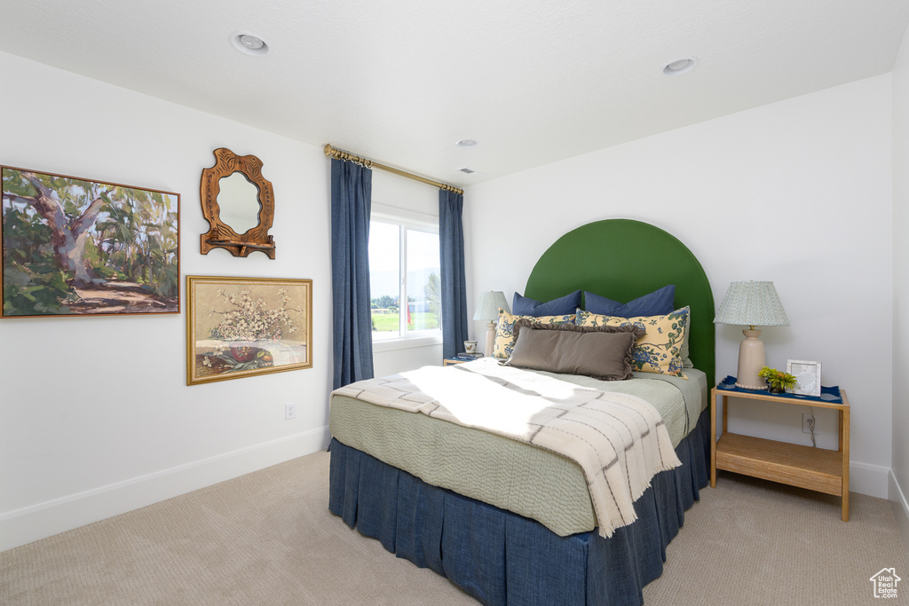 Bedroom featuring recessed lighting, baseboards, and light colored carpet