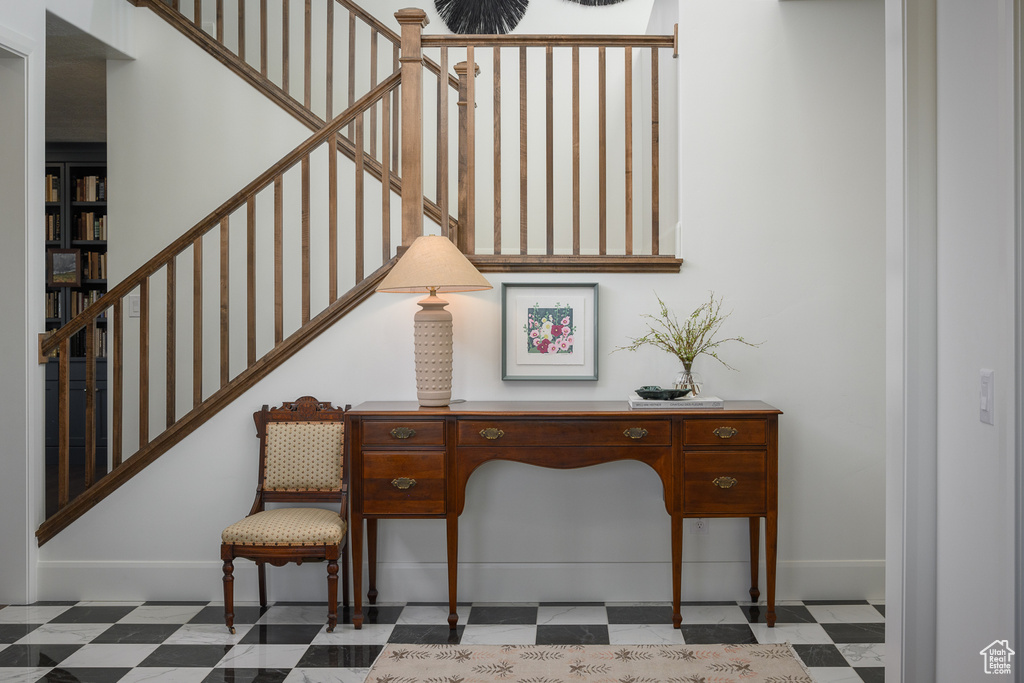 Stairs featuring tile patterned floors and baseboards