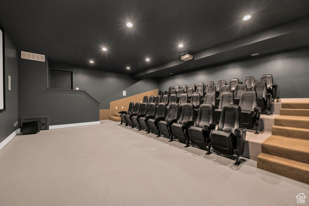 Home theater room featuring recessed lighting, baseboards, and visible vents