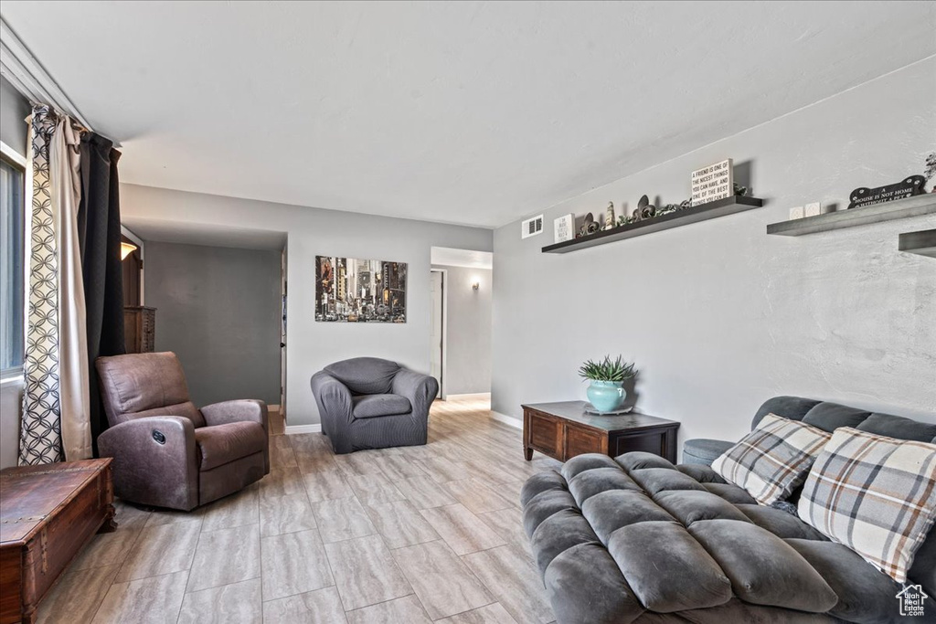 Living room with baseboards and visible vents
