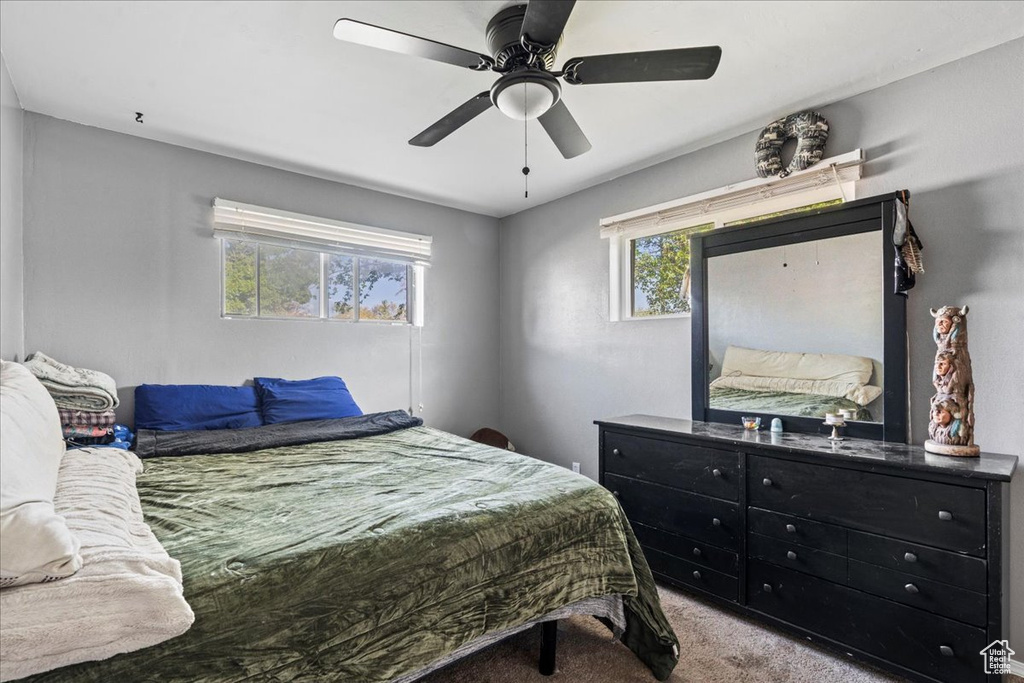 Bedroom featuring carpet and a ceiling fan