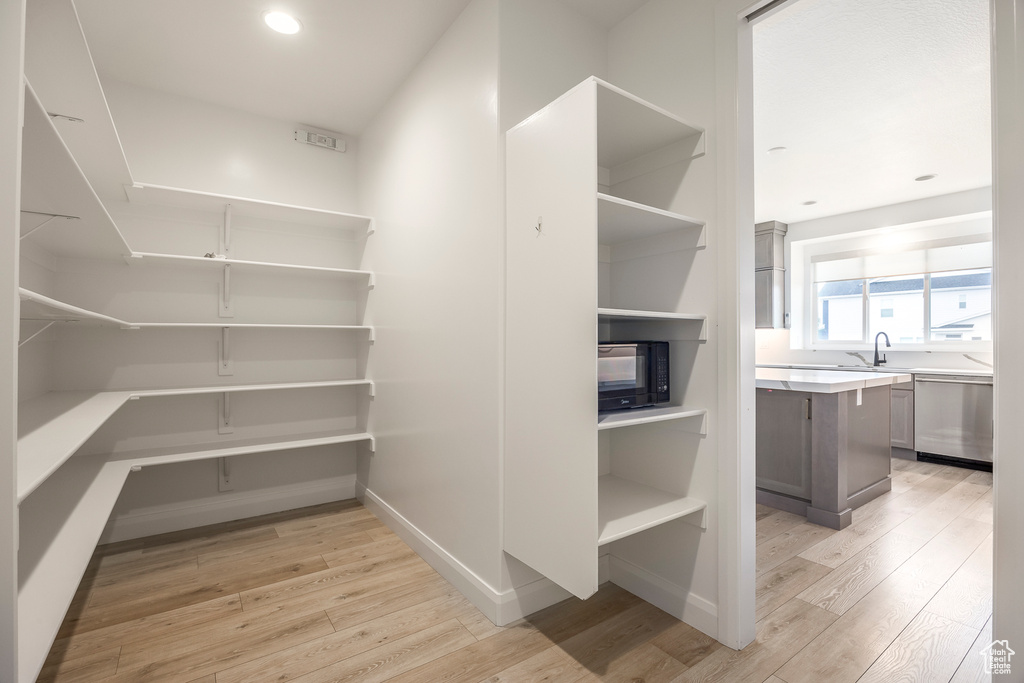 Pantry featuring a sink