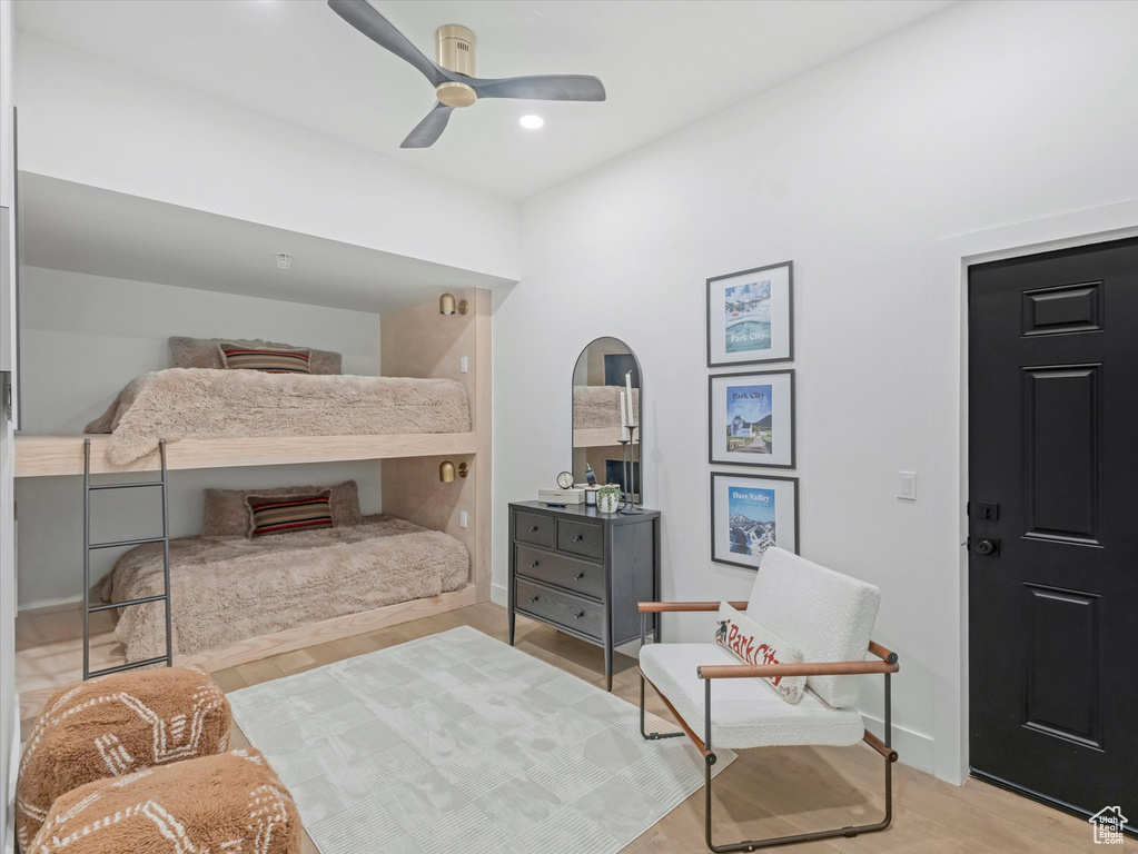Bedroom with baseboards, ceiling fan, and wood finished floors