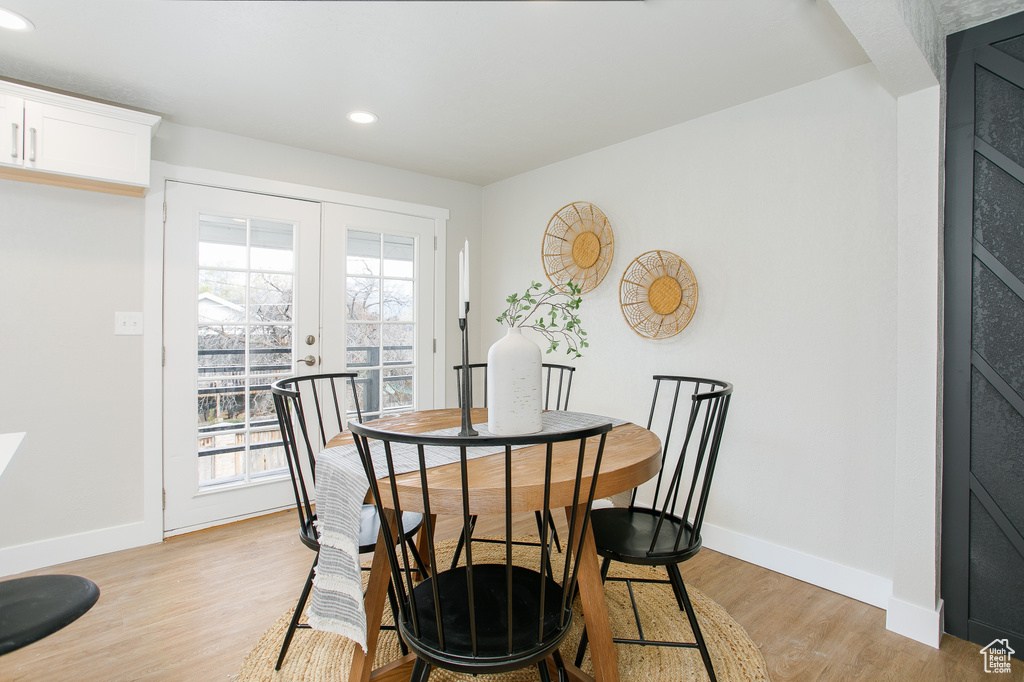 Dining room featuring french doors, recessed lighting, light wood-style flooring, and baseboards