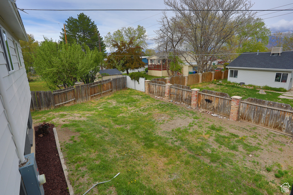 View of yard with a fenced backyard