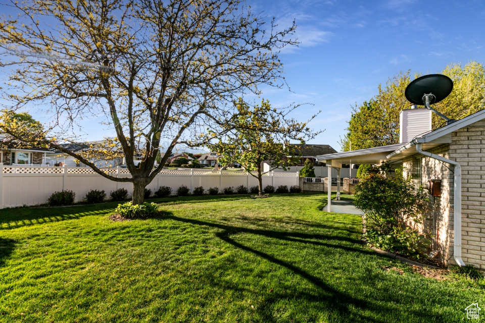 View of yard featuring fence