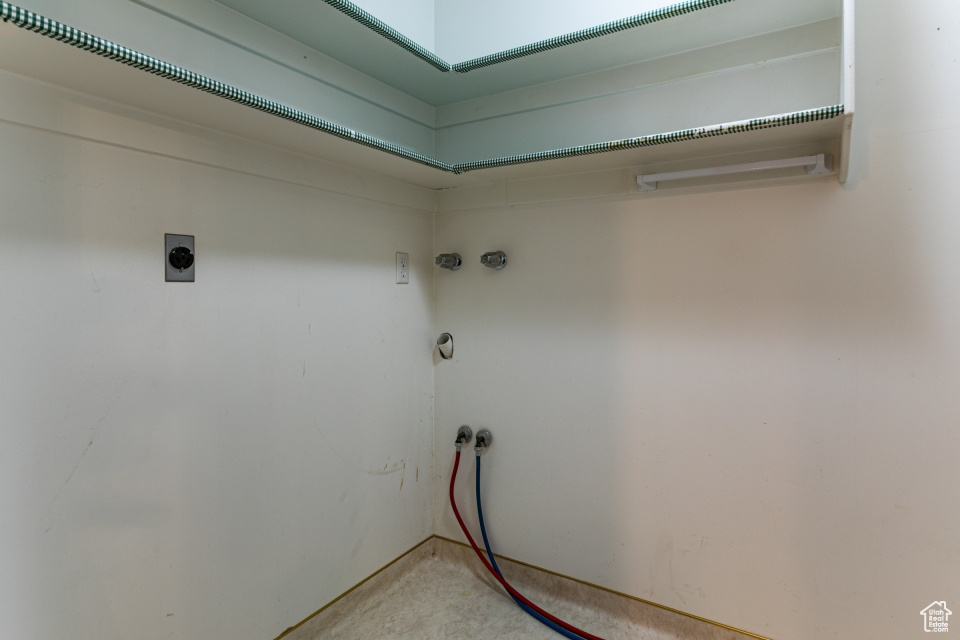 Laundry area featuring laundry area, electric dryer hookup, hookup for a washing machine, and light carpet
