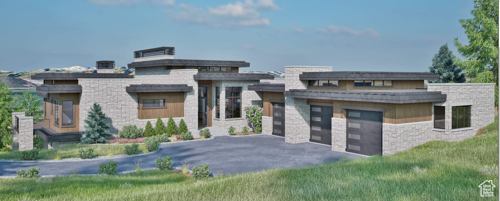 Modern home with driveway, stone siding, and a garage