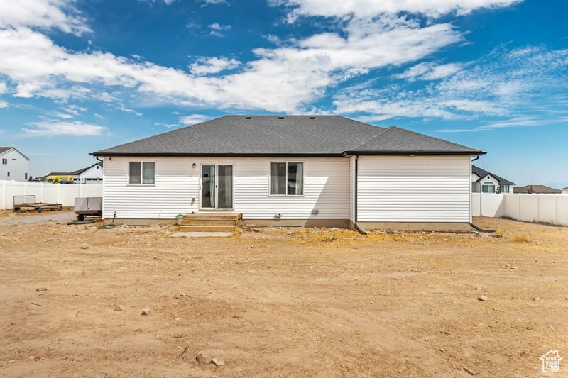 Back of property with fence