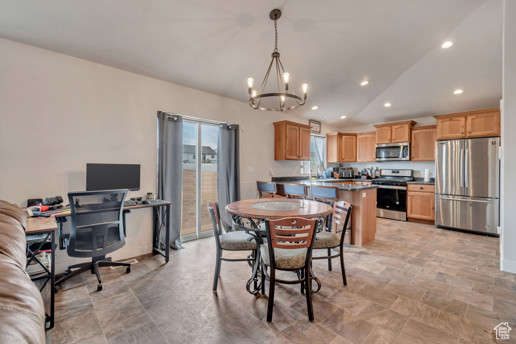 Dining area with recessed lighting, a notable chandelier, and lofted ceiling