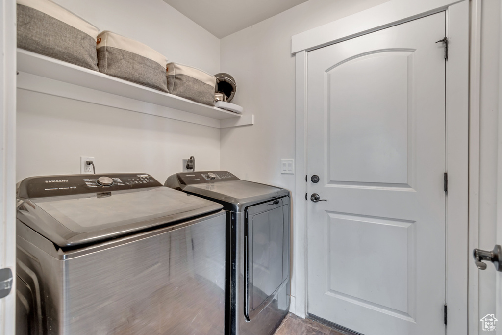 Washroom with washer and dryer and laundry area
