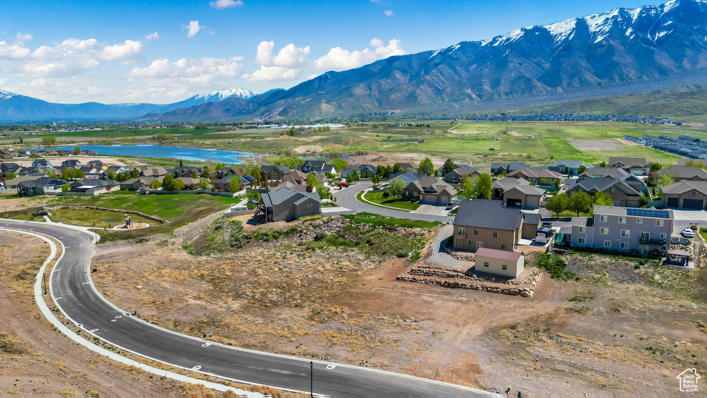 Aerial view featuring a residential view and a water and mountain view