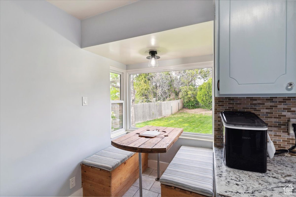 Exterior space with light tile patterned flooring
