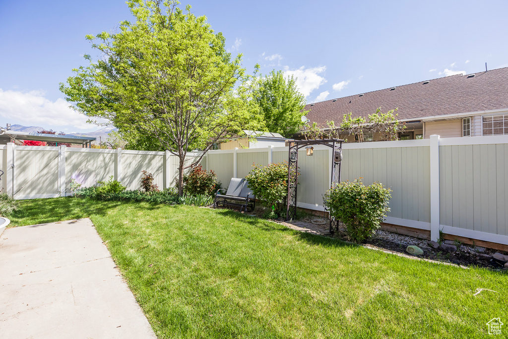 View of yard featuring a patio and a fenced backyard