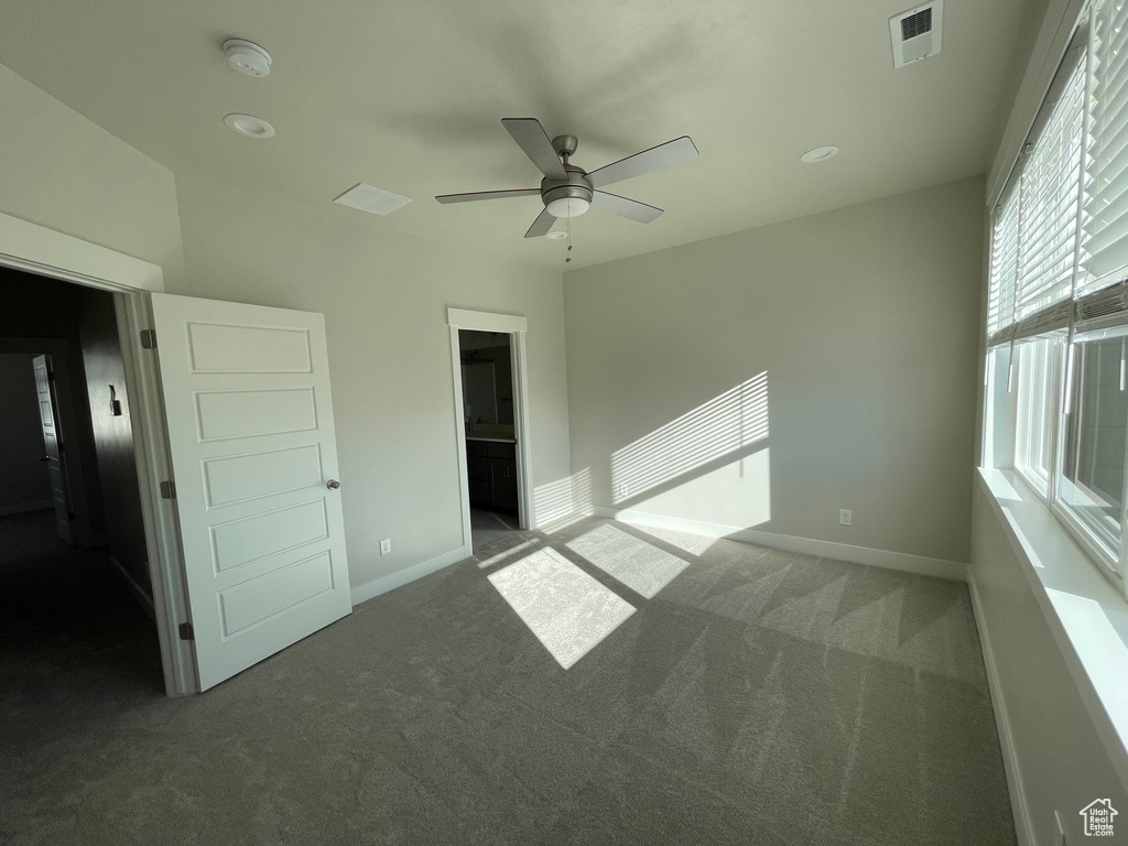 Unfurnished bedroom featuring carpet, baseboards, recessed lighting, and a ceiling fan