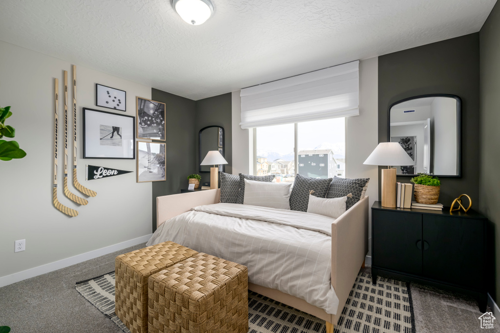 Bedroom with carpet floors and baseboards