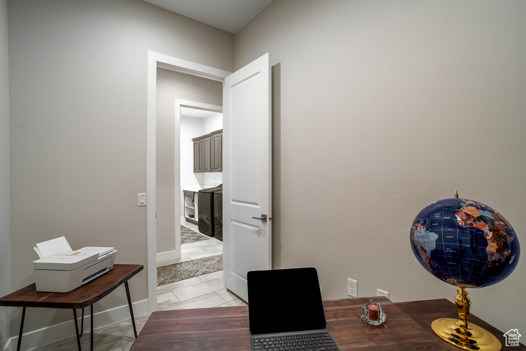 Office area featuring baseboards