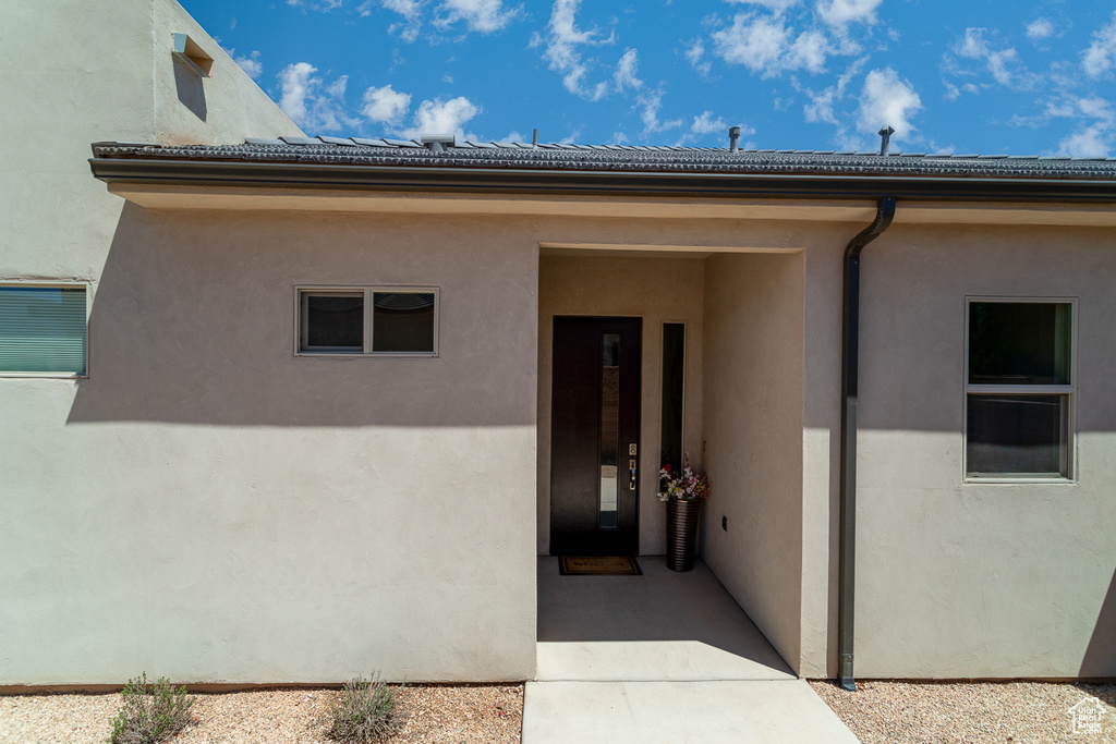 Property entrance with stucco siding