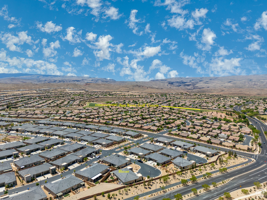 Drone / aerial view featuring a mountain view and a residential view