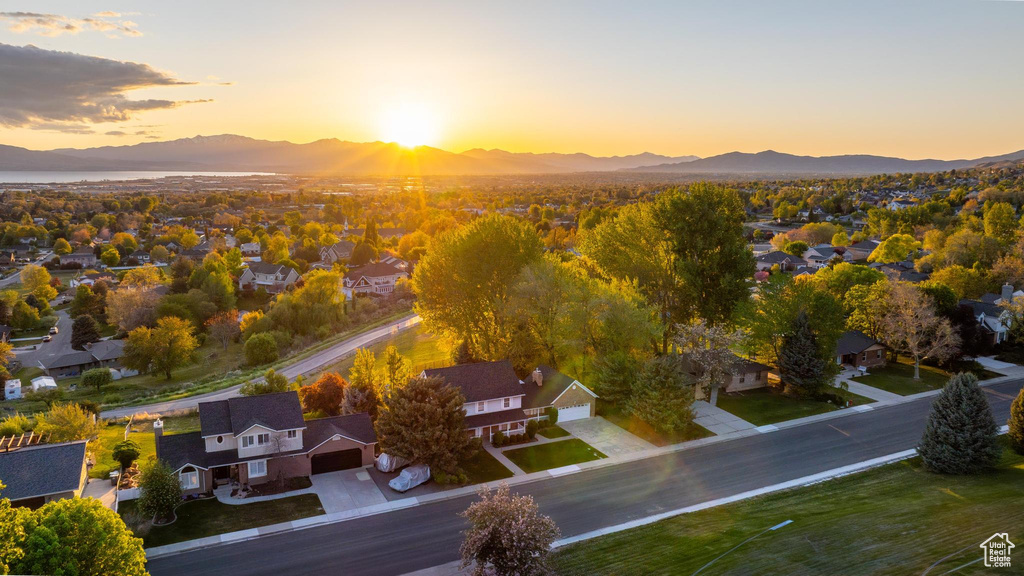 Aerial view at dusk featuring a residential view and a mountain view