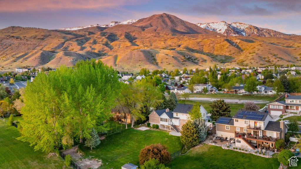 Property view of mountains with a residential view