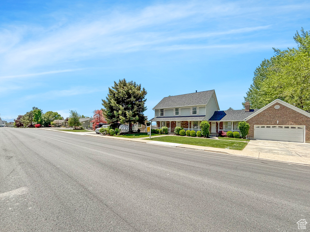 View of asphalt road with sidewalks and curbs