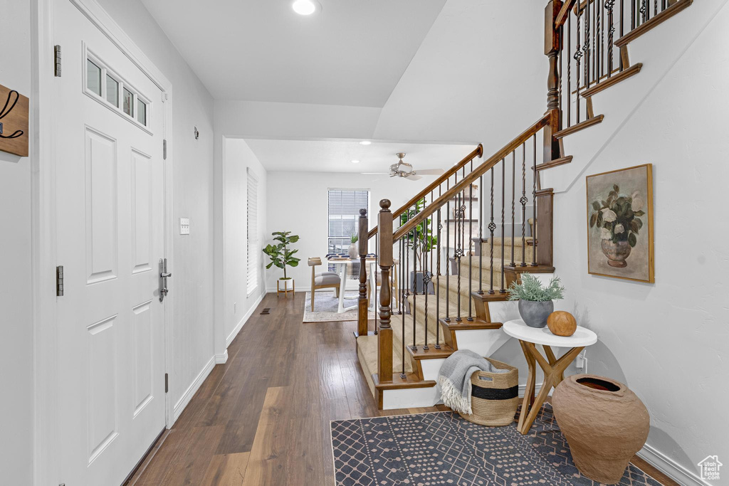 Entrance foyer with stairs, baseboards, dark wood-style floors, recessed lighting, and a ceiling fan