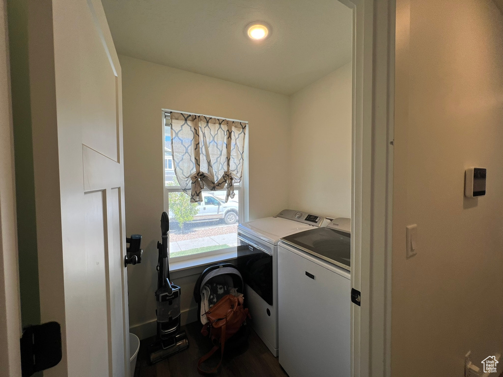 Washroom featuring recessed lighting, laundry area, washing machine and dryer, and dark wood finished floors