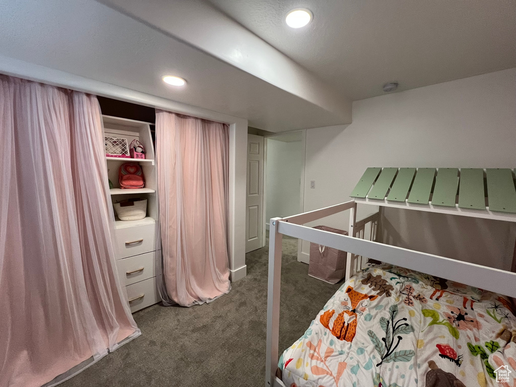 Bedroom featuring recessed lighting and dark colored carpet
