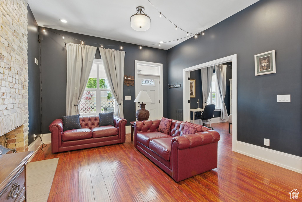 Living room with baseboards and wood finished floors