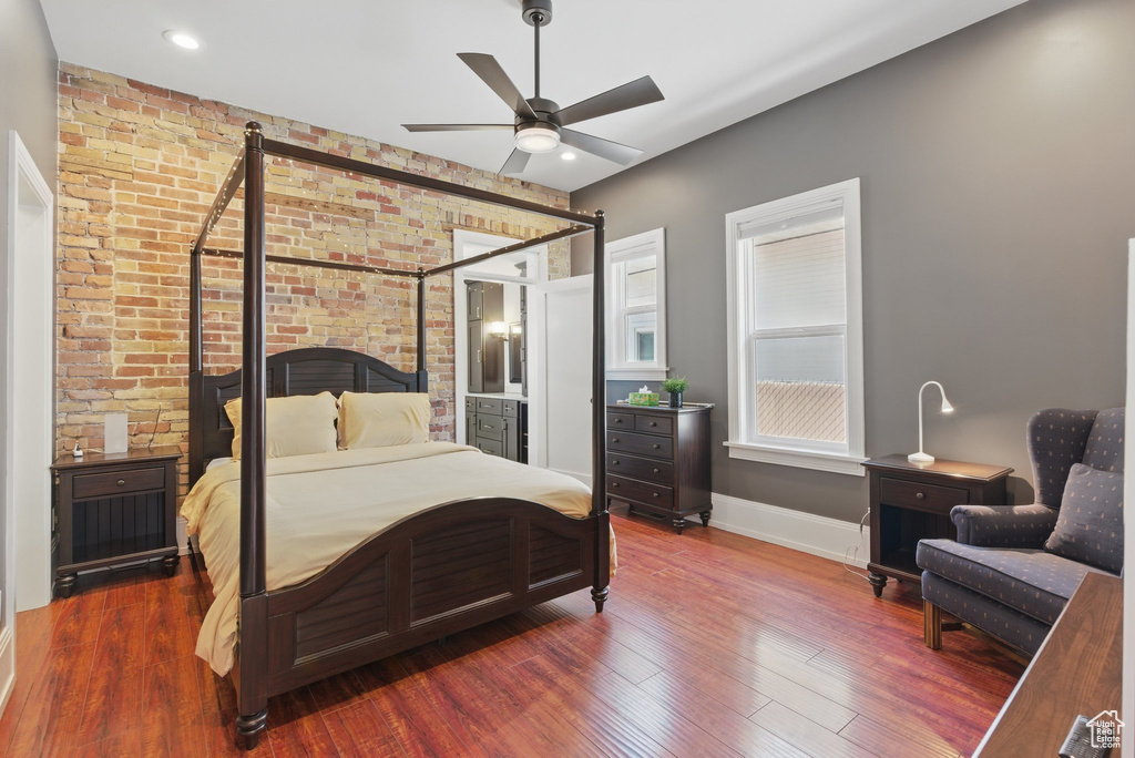 Bedroom featuring baseboards, ceiling fan, and wood finished floors