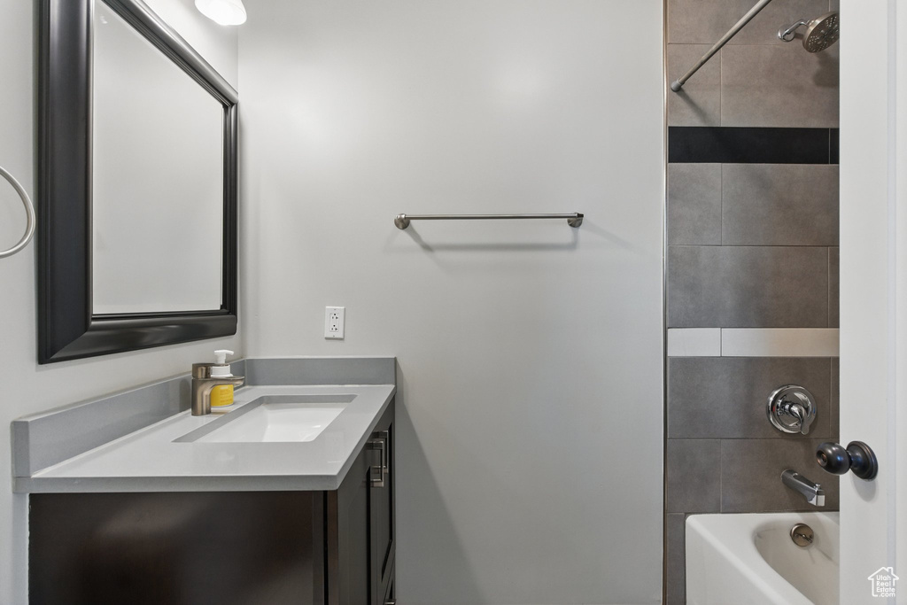Full bathroom featuring shower / bathing tub combination and vanity