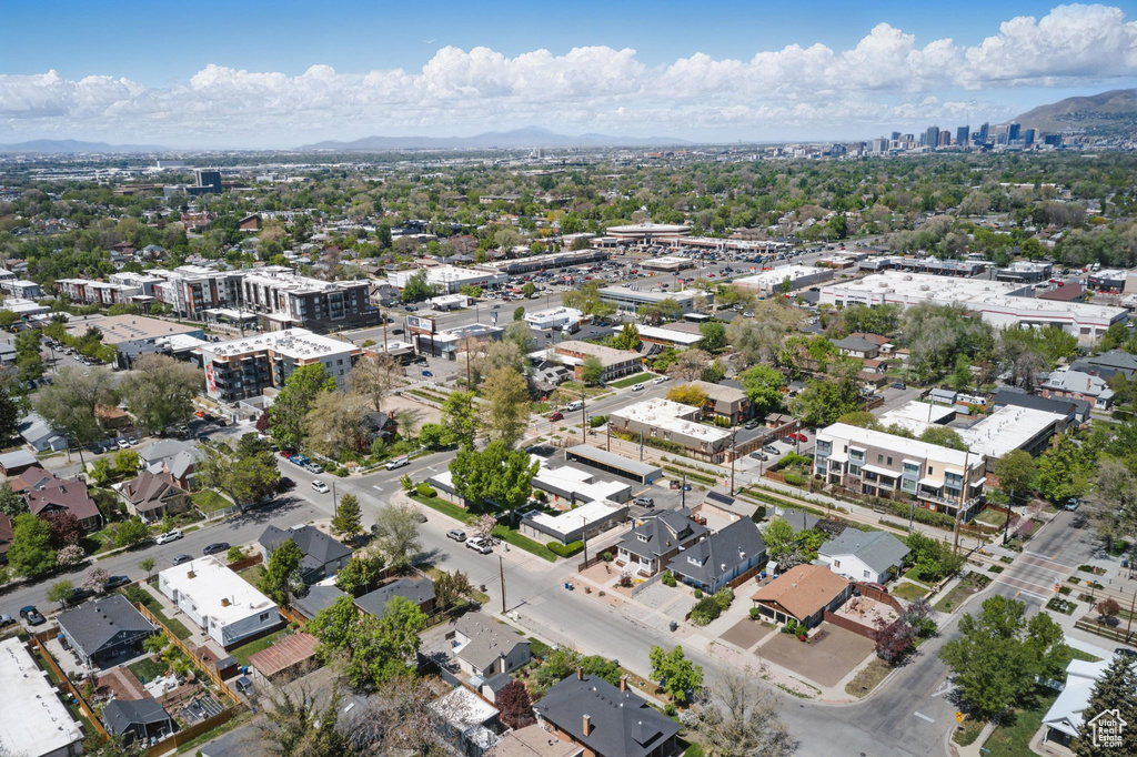 Birds eye view of property featuring a view of city and a mountain view