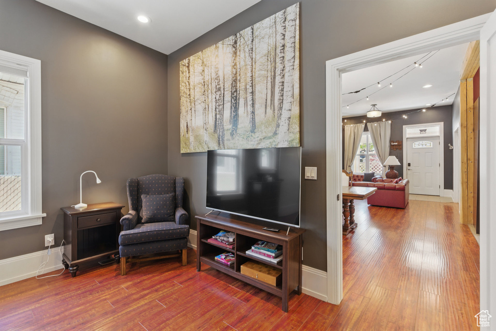 Living area featuring baseboards and wood finished floors
