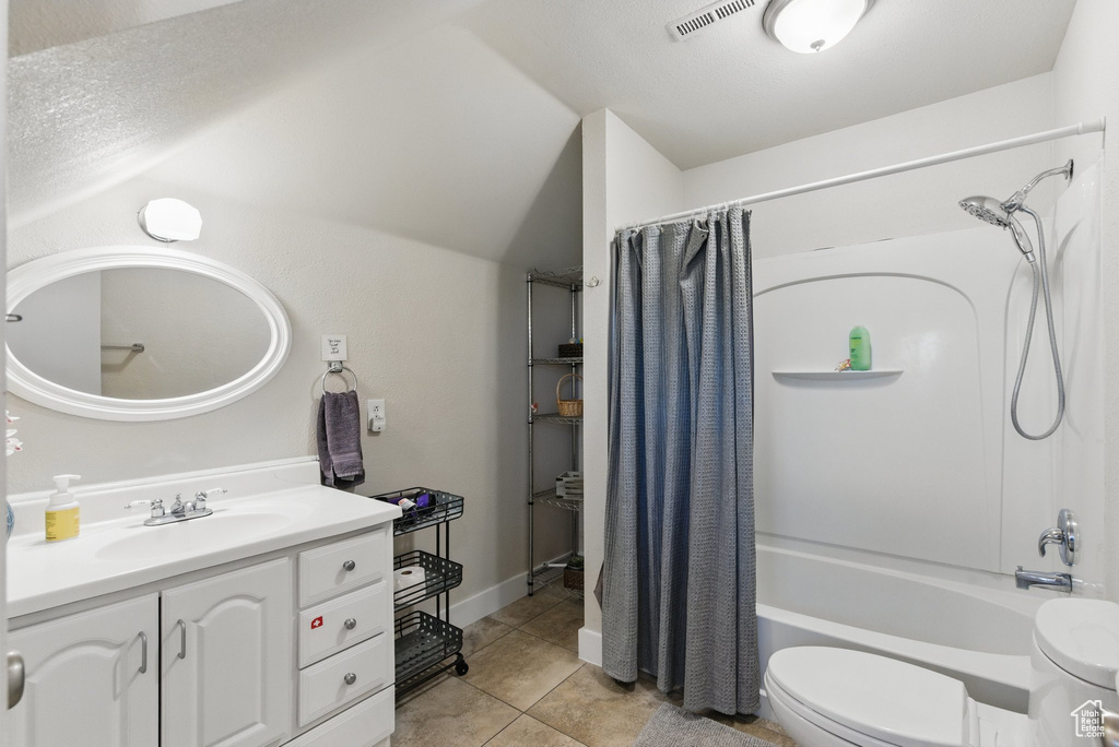 Bathroom with visible vents, tile patterned flooring, vanity, toilet, and shower / bathtub combination with curtain
